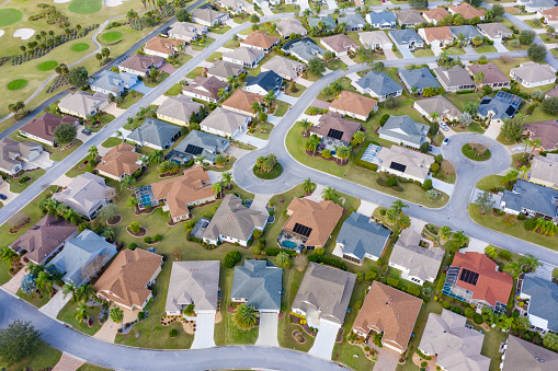 Drone view of residential neighborhood and golf course located in The Villages, a retirement and golfing community in Florida.