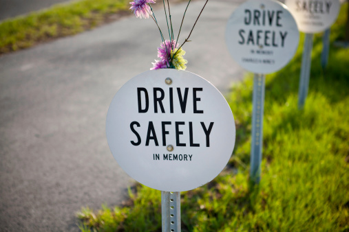 drive safely sign on the side of the road